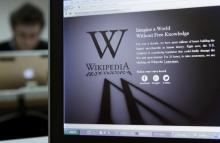 A reporter's laptop shows the Wikipedia blacked out opening page in Brussels, January 18, 2012. PHOTO BY REUTERS/Yves Herman
