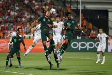 Nigeria's William Troost-Ekong and Chidozie Awaziem in action with Algeria's Baghdad Bounedjah. PHOTO BY REUTERS/Amr Abdallah Dalsh