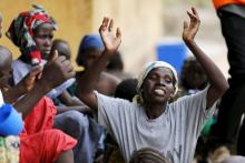 A woman rescued from Boko Haram in Sambisa forest is seen celebrating her freedom at Malkohi camp for Internally Displaced People in Yola, Adamawa State, Nigeria, May 3, 2015. PHOTO BY REUTERS/Afolabi Sotunde