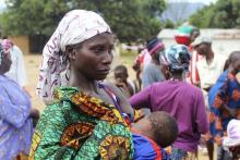 A woman queues for food at a World Food Programme distribution point in Freetown, October 18, 2014. PHOTO BY REUTERS/Josephus Olu-Mamma