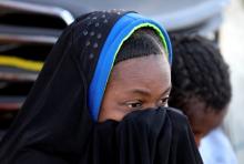 A migrant looks on as she is rescued by Libyan coast guards in the Mediterranean Sea off the coast of Libya, January 15, 2018. PHOTO BY REUTERS/Hani Amara