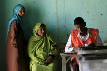 Women wait to cast their ballots on the second day of elections in north Khartoum April 14, 2015. REUTERS/ Mohamed Nureldin Abdallah