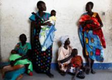 Women hold their babies as they wait for a medical check-up at a United Nations International Children's Fund (UNICEF) supported mobile health clinic in Nimini village, Unity State, South Sudan, February 8, 2017. PHOTO BY REUTERS/Siegfried Modola