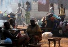 Women are pictured in a camp for internally displaced people on the grounds of the Saint Sauveur church in the capital Bangui, Central African Republic, November 25, 2015. PHOTO BY REUTERS/Siegfried Modola