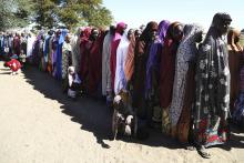 Women who have fled violence in Nigeria queue for food at a refugee welcoming center in Ngouboua, Chad, January 19, 2015. PHOTO BY REUTERS/Emmanuel Braun