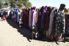 Women who have fled violence in Nigeria queue for food at a refugee welcoming center in Ngouboua, Chad, January 19, 2015. PHOTO BY REUTERS/Emmanuel Braun