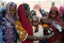 Women wait with their children under a shed for food rations at an internally displaced persons (IDP) camp on the outskirts of Maiduguri, northeast Nigeria, June 6, 2017. PHOTO BY REUTERS/Akintunde Akinleye