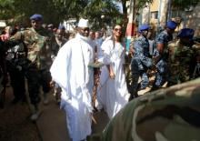 Gambian President Yahya Jammeh arrives at a polling station with his wife Zineb during the presidential election in Banjul, Gambia, December 1, 2016. PHOTO BY REUTERS/Thierry Gouegnon