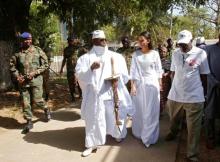 Gambian President Yahya Jammeh leaves a polling station with his wife Zineb during the presidential election in Banjul, Gambia, December 1, 2016. PHOTO BY REUTERS/Thierry Gouegnon