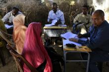 Special Prosecutor for Crimes in Darfur Yasir Ahmed Mohamed (R) and his team talk to women during an investigation into allegations of mass rape in the village of Tabit, in North Darfur, November 20, 2014. PHOTO BY REUTERS/Mohamed Nureldin Abdallah