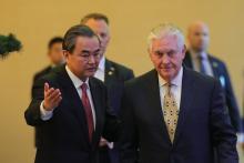 Chinese Foreign Minister Wang Yi and U.S. Secretary of State Rex Tillerson arrive for a joint press conference at Diaoyutai State Guesthouse in Beijing, China, March 18, 2017. PHOTO BY REUTERS/Lintao Zhang