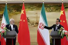 Iranian Foreign Minister Mohammad Javad Zarif (L) and Chinese Foreign Minister Wang Yi attend a news conference after a bilateral meeting in Beijing, China, September 15, 2015. PHOTO BY REUTERS/Lintao Zhang
