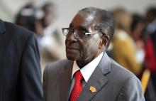 Zimbabwe's President Robert Mugabe arrives for the extraordinary session of the African Union's Assembly of Heads of State and Government