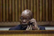 Former South African President Jacob Zuma speaks on the phone during the court appearance of his son Duduzane Zuma at the Randburg Magistrates Court, South Africa, August 23, 2018. PHOTO BY REUTERS/Siphiwe Sibeko