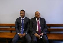 Duduzane Zuma sits with his farther, former South African president Jacob Zuma, ahead of Duduzane's appearance at the Specialised Commercial Crimes Court in Johannesburg, South Africa, January 24, 2019. PHOTO BY REUTERS/Siphiwe Sibeko