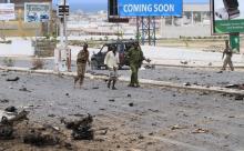 Somali government soldiers walk outside the Parliament during a clash with Al Shabaab militants in the capital Mogadishu