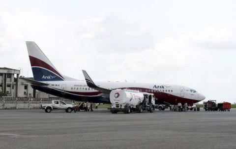 A Boeing 737-7BD Arik Air aeroplane is seen parked on the tarmac at the local airport in Lagos. PHOTO BY REUTERS/Akintunde Akinleye