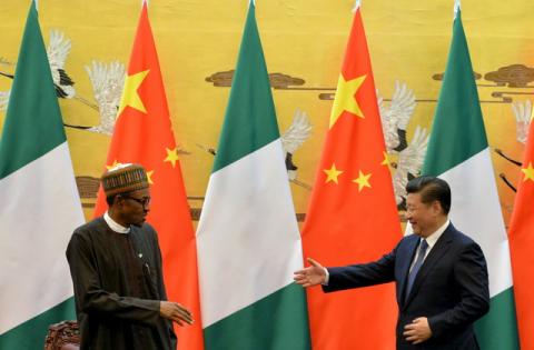 President of the Federal Republic of Nigeria, Muhammadu Buhari (L) and Chinese President, Xi Jinping shake hands during a signing ceremony at the Great Hall of the People in Beijing, April 12, 2016. PHOTO BY REUTERS/Kenzaburo Fukuhara