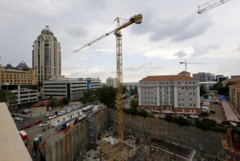Construction is seen below the skyline of Johannesburg's upmarket Sandton suburb, February 5, 2016. PHOTO BY REUTERS/Mike Hutchings