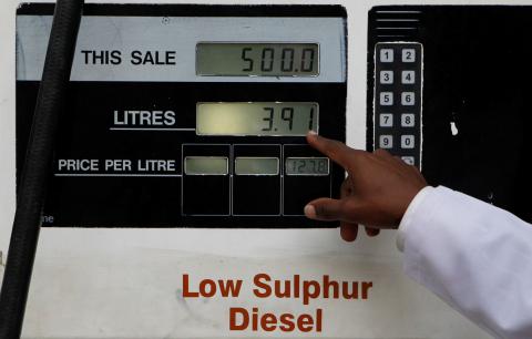 A fuel pump attendant points at fuel pump during the beginning of an indefinite strike at a petrol station in downtown Nairobi, Kenya, September 3, 2018. PHOTO BY REUTERS/Njeri Mwangi