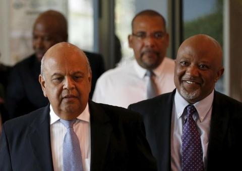 South Africa's Deputy Finance Minister Mcebisi Jonas (R) and Finance Minister Pravin Gordhan arrive for a media briefing in Pretoria, December 14, 2015. PHOTO BY REUTERS/Siphiwe Sibeko
