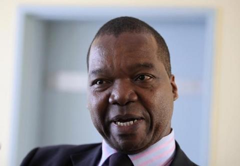 Zimbabwe's Reserve Bank Governor John Mangudya gestures while responding to questions in the country's parliament in Harare, June 30, 2014. PHOTO BY REUTERS/Philimon Bulawayo