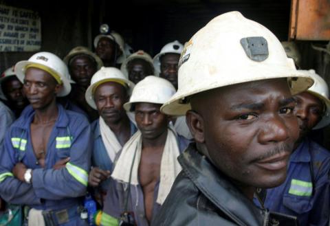 Konkola Copper Mines PLC workers wait in a lift before going to work underground in Konkola, April 12, 2005. PHOTO BY REUTERS/Stringer