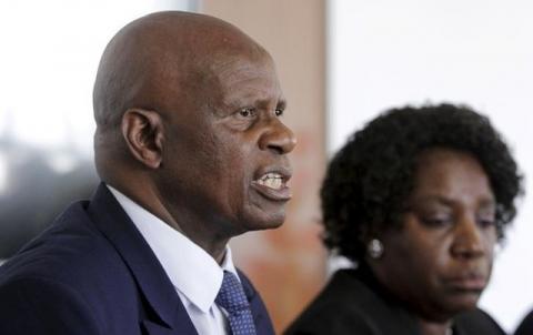 Zimbabwe's Finance Minister Patrick Chinamasa (L) addresses a media conference in a file photo. PHOTO BY REUTERS/Philimon Bulawayo