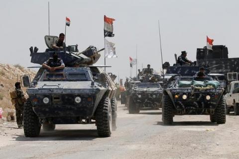 Iraqi federal police advance towards Falluja, Iraq, May 24, 2016. PHOTO BY REUTERS/Thaier Al-Sudani