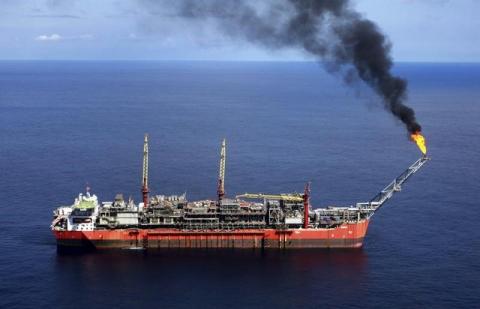 A ship loads crude oil at Bonga off-shore oil field outside Lagos. PHOTO BY REUTERS/Akintunde Akinleye