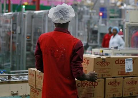 A worker stacks the boxes of toothpaste produced at the Unilever factory in Lagos, Nigeria, January 18, 2018. PHOTO BY REUTERS/Afolabi Sotunde