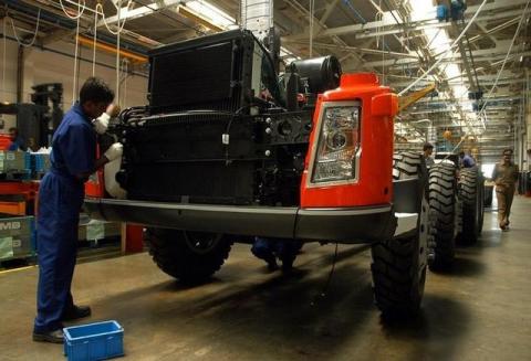 An Indian mechanic works at the Volvo truck division in Bangalore. PHOTO BY REUTERS