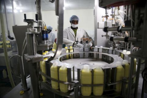 A dairy worker helps to process youghurt milk at the L & Z milk processing factory in Nigeria's northern city of Kano, January 19, 2016. PHOTO BY REUTERS/Akintunde Akinleye
