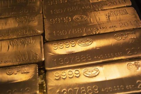 24 karat gold bars are seen at the United States West Point Mint facility