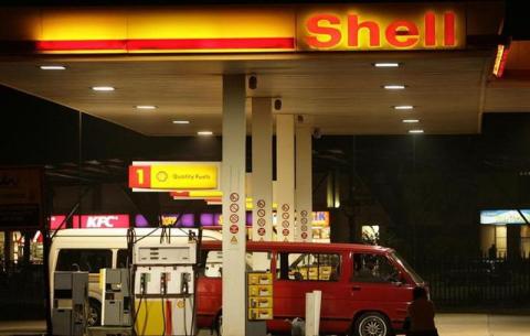 A customer waits to be attended to at a petrol station