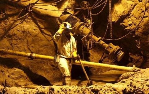 A South African mine worker underground 