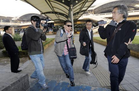 A relative of Filipino Rizalina Bunyi, who died in the car incident which killed five pedestrians in front of Tiananmen Gate on Monday, is pictured as he and other relatives arrive at Beijing airport