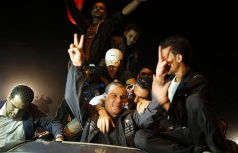 A released Palestinian prisoner reacts upon his arrival at the Erez crossing between Israel and the northern Gaza Strip