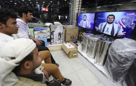 People watch as leader of Yemen's Houthi movement Abdel Malek al-Houthi delivers a live speech in Sanaa, January 20, 2015. PHOTO BY REUTERS/Mohamed al-Sayaghi