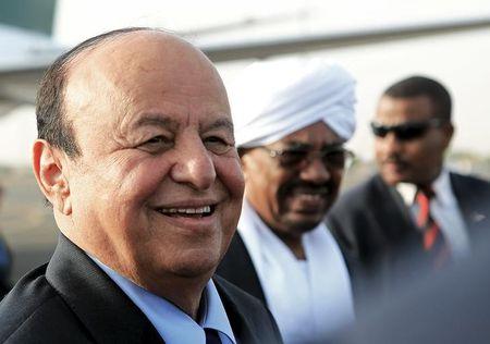 Yemen's President Abd-Rabbu Mansour Hadi smiles near Sudan's President Omar Hassan al-Bashir (C) upon arrival at Khartoum Airport, August 29, 2015. PHOTO BY REUTERS/Mohamed Nureldin Abdallah