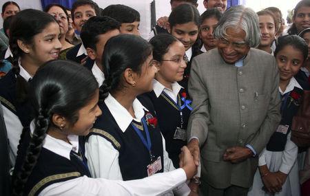 School children shake hands with India's former president A.P.J. Abdul Kalam during a silver jubilee function as part of Children's Day celebrations in Chandigarh, November 14, 2008. PHOTO BY REUTERS/Ajay Verma