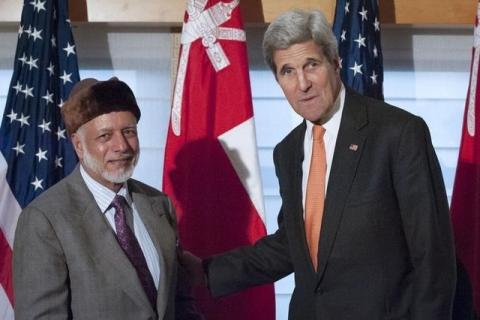 United States Secretary of State John Kerry (R) shakes hands with Foreign Minister Yusuf bin Alawi bin Abdullah of Oman as they pose for photos at the Palace Hotel in New York, October 2, 2015. PHOTO BY REUTERS/Stephanie Keith