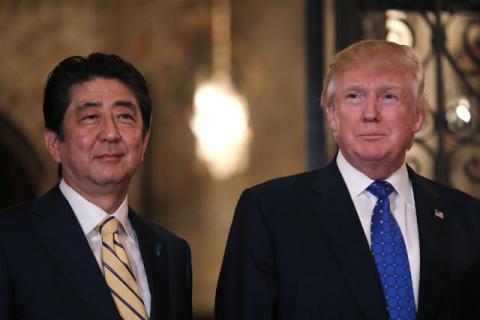 Japanese Prime Minister Shinzo Abe and U.S. President Donald Trump pose for a photograph before attending dinner at Mar-a-Lago Club in Palm Beach, Florida, U.S., February 11, 2017. PHOTO BY REUTERS/Carlos Barria