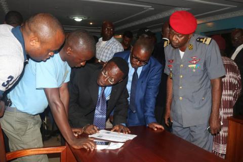Fontem Aforteka'a Neba (3rd L) and Felix Agbor Balla (2nd R) two Anglophone activists leaders prepare to sign a document during their release at the prison of Yaounde, Cameroon, September 1, 2017. PHOTO BY REUTERS/Stringer