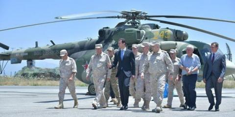 Syria's President Bashar al-Assad visits a Russian air base at Hmeymim, in western Syria in this handout picture posted on SANA on June 27, 2017, Syria. PHOTO BY REUTERS/SANA
