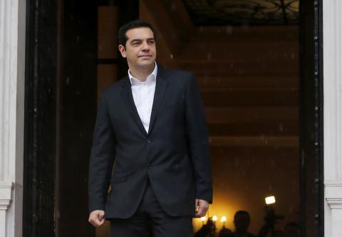 Greek Prime Minister Alexis Tsipras waits for European Parliament President Martin Schulz outside the Greek Premier's office in Athens, January 29, 2015. PHOTO BY REUTERS/Marko Djurica