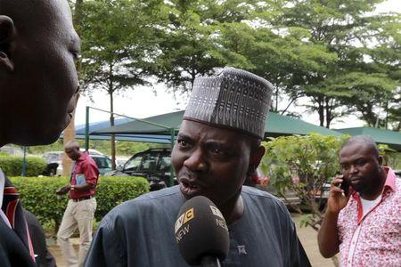 Ali Ahmad (C), speaker of the Kwara State House of Assembly, answers a journalist's questions at Nigeria's Code of Conduct Tribunal where Senate President Bukola Saraki is expected to turn up, in Abuja, Nigeria, September 21, 2015. PHOTO BY REUTERS/Afolabi Sotunde