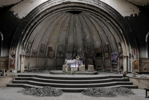 An altar of a damaged church is seen in the town of Qaraqosh, south of Mosul, Iraq, April 11, 2017. PHOTO BY REUTERS/Marko Djurica