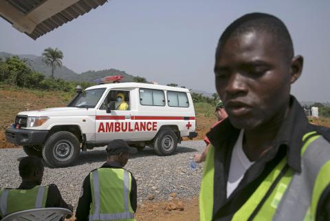 An ambulance transporting a newly admitted Ebola patient drives to the entrance of the Save the Children Kerry Town Ebola treatment centre outside Freetown, Sierra Leone, December 22, 2014. PHOTO BY REUTERS/Baz Ratner