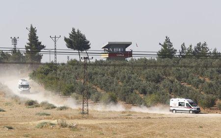 Ambulances leave from the Dag military post, which was attacked by Islamic State militants on Thursday, on the Turkish-Syrian border near Kilis, Turkey, July 24, 2015. PHOTO BY REUTERS/Murad Sezer
